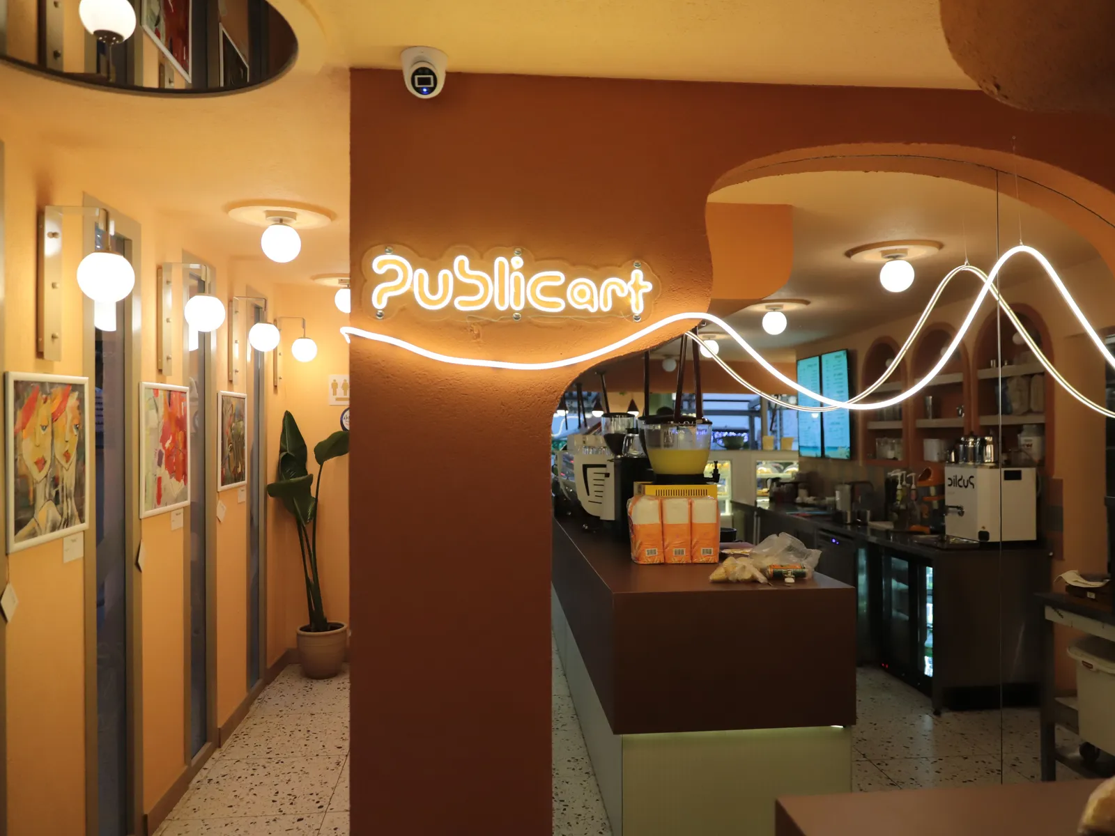 The art wall, neon sign and bar